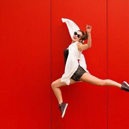 Creative Brand Land- Color Psychology- Red-Woman Dancing- Red Wall